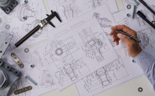Engineer reviewing RFQ files and project background before quotation