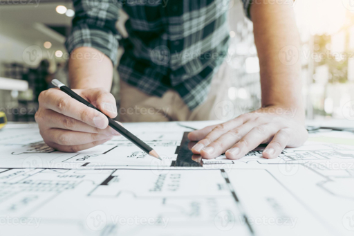 Engineer checking drawings and RFQ information checklist for CNC machining